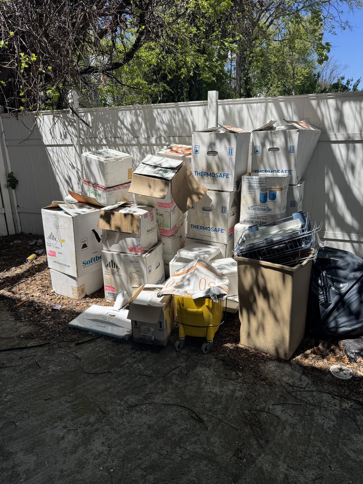Boxes and unwanted items before junk removal service