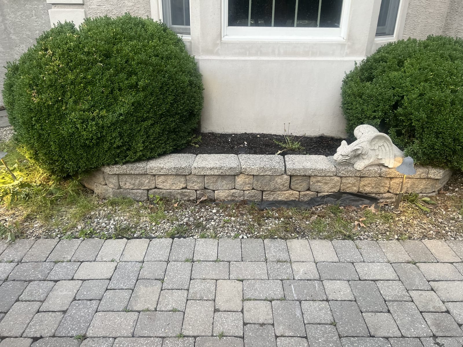 Clean retaining wall after soft washing service