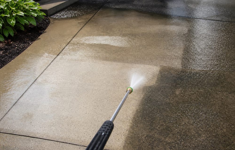 Pressure washing concrete walkway in North Jersey